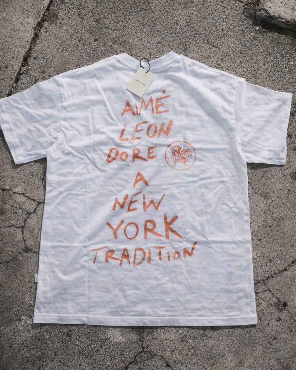 Aime Leon Dore White Back-Print T-Shirt with Peach Hand‑Lettered Graphic — vintage back-print tee alternate ecommerce image
