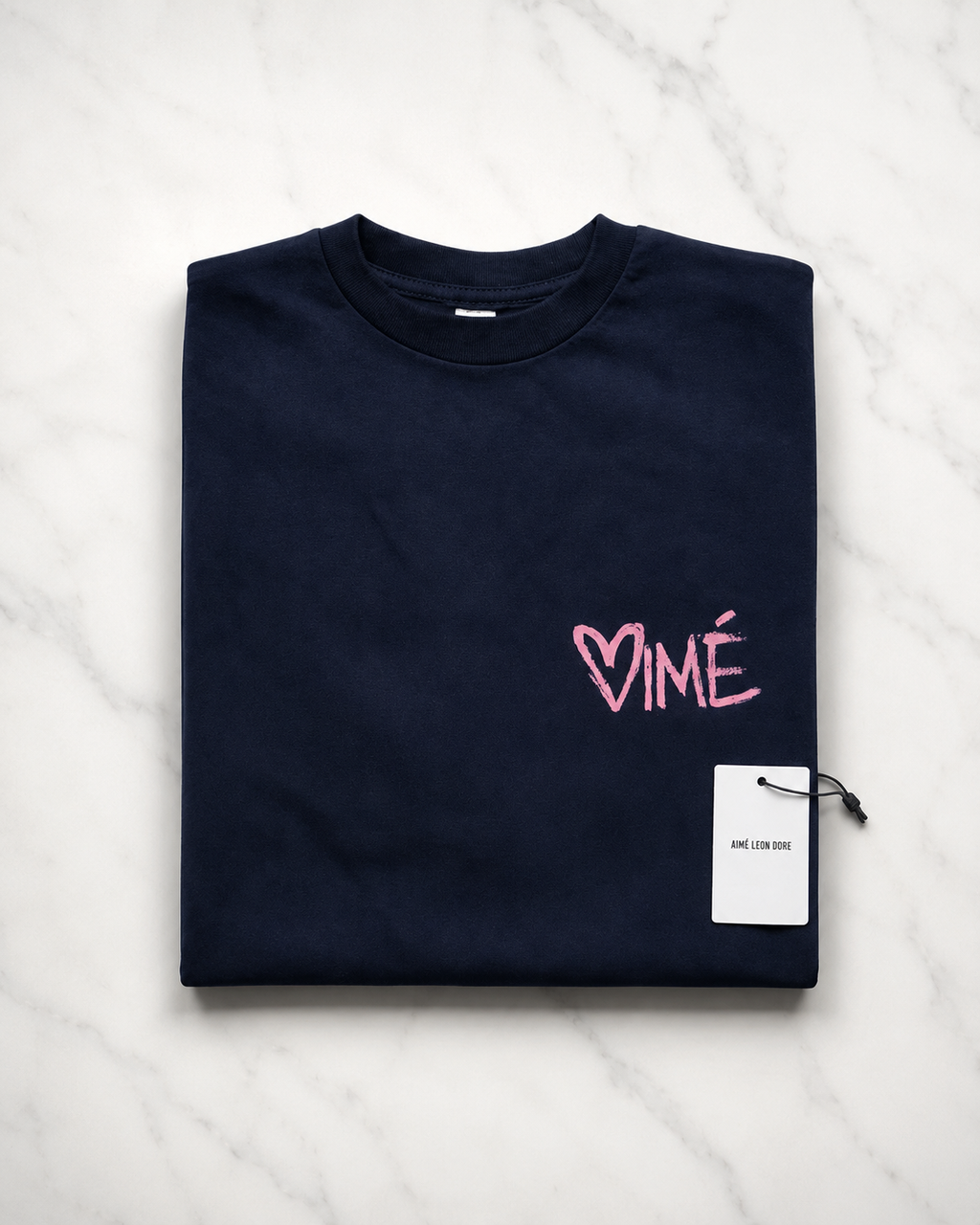 Aime Leon Dore White Back-Print T-Shirt with Peach Hand‑Lettered Graphic — vintage back-print tee