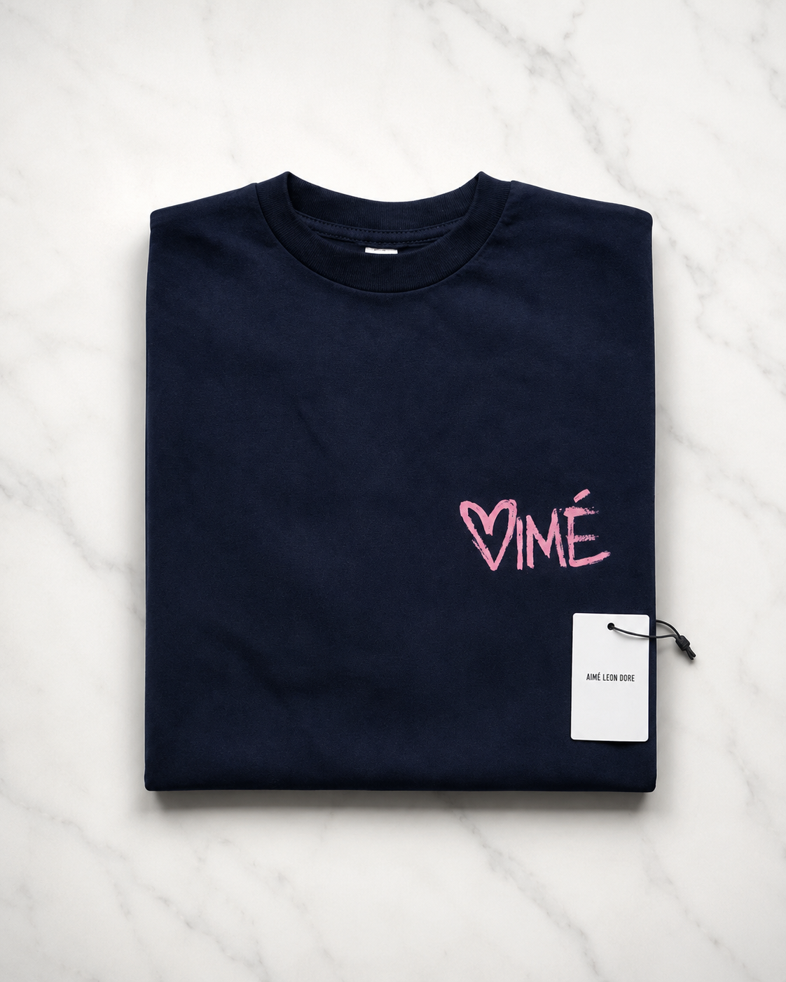 Aime Leon Dore White Back-Print T-Shirt with Peach Hand‑Lettered Graphic — vintage back-print tee